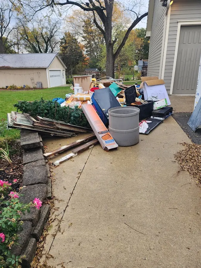 Dumpster being loaded with debris for 12 Yard Dumpster Rental in Codorus